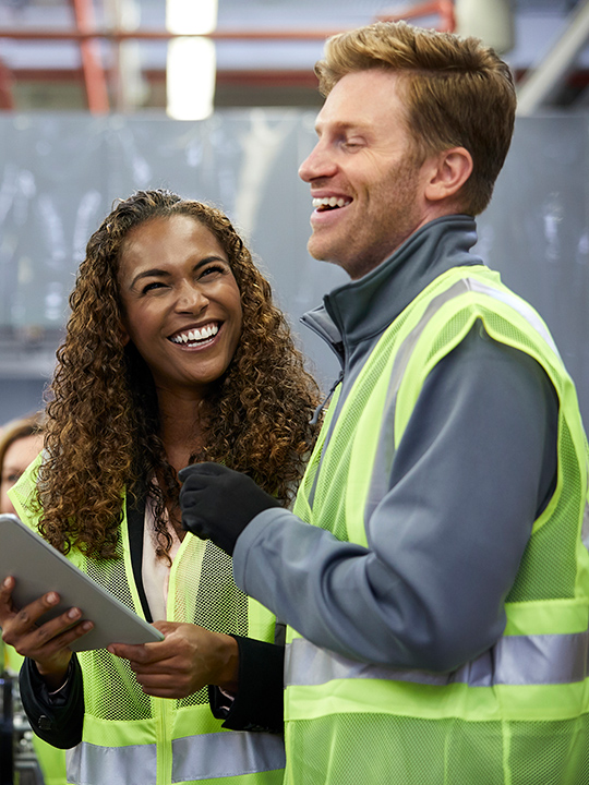 Two factory managers reviewing the factory line