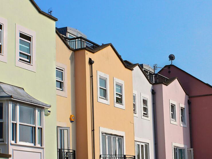 Bright colored townhouses with geometric shapes 