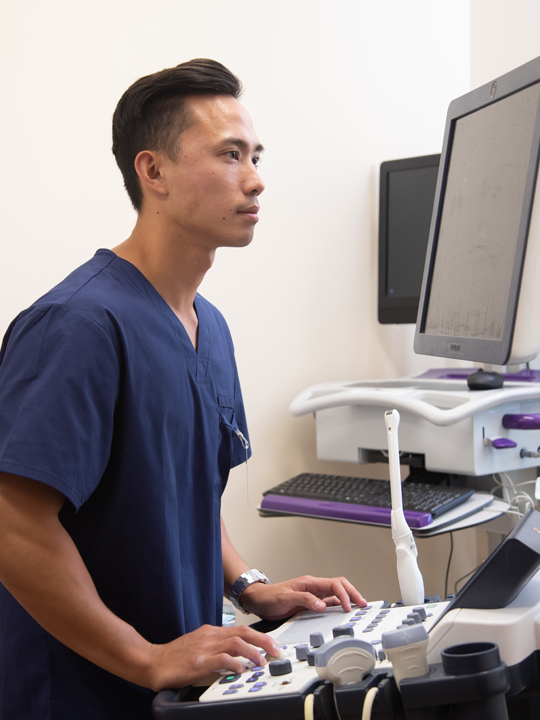 A nurse using medical equipment