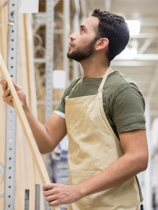 A man constructing a wall