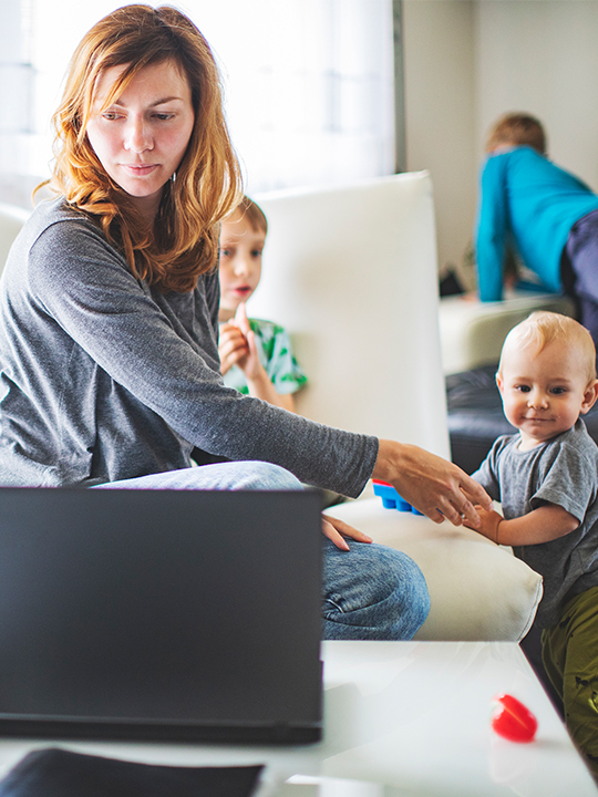 busy mother taking care of children