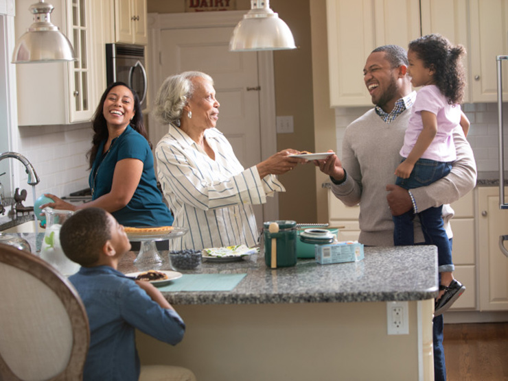 family with elder in kitchen