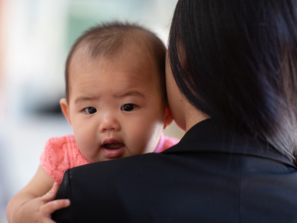  A mother holding her infant.