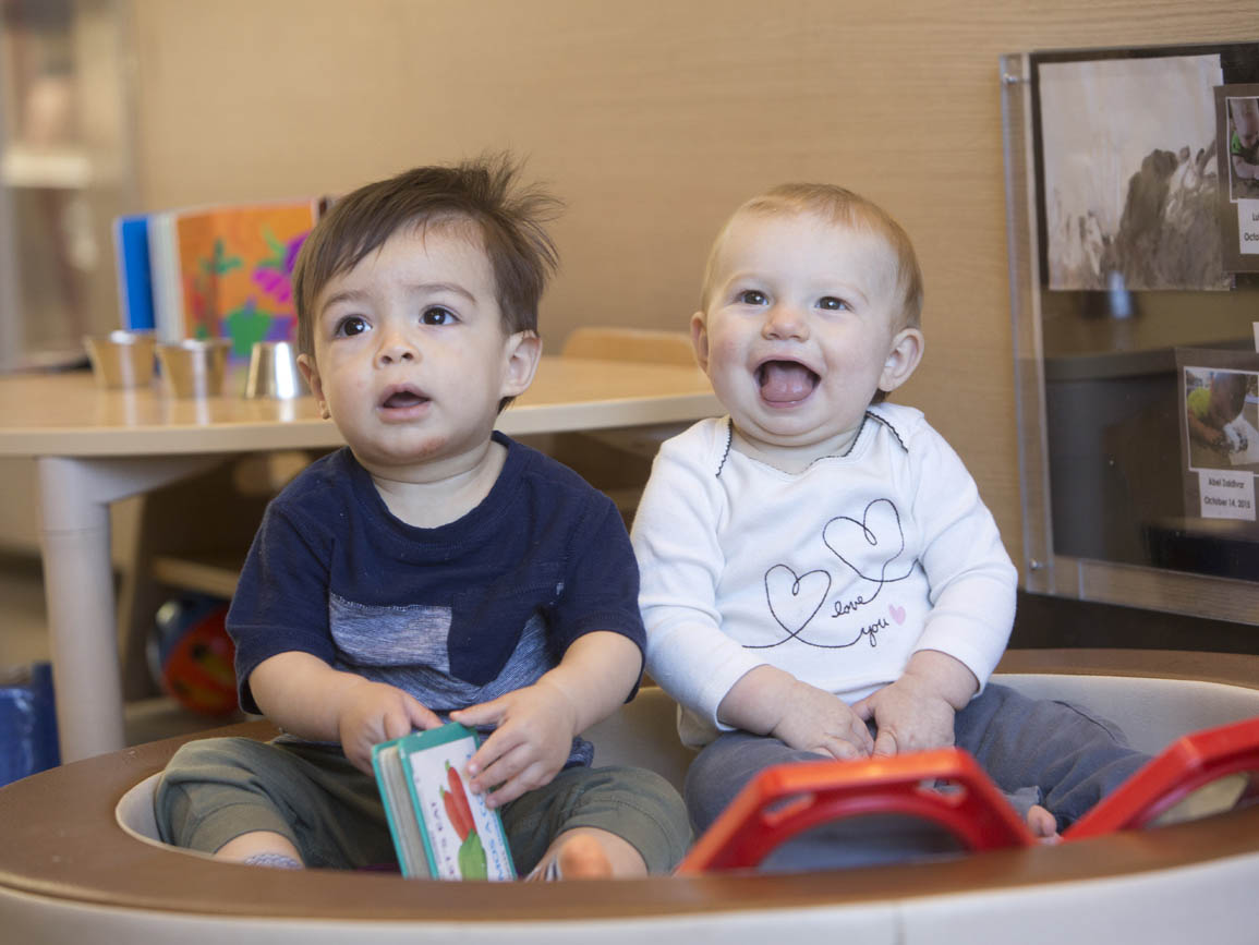 Two infants sitting together