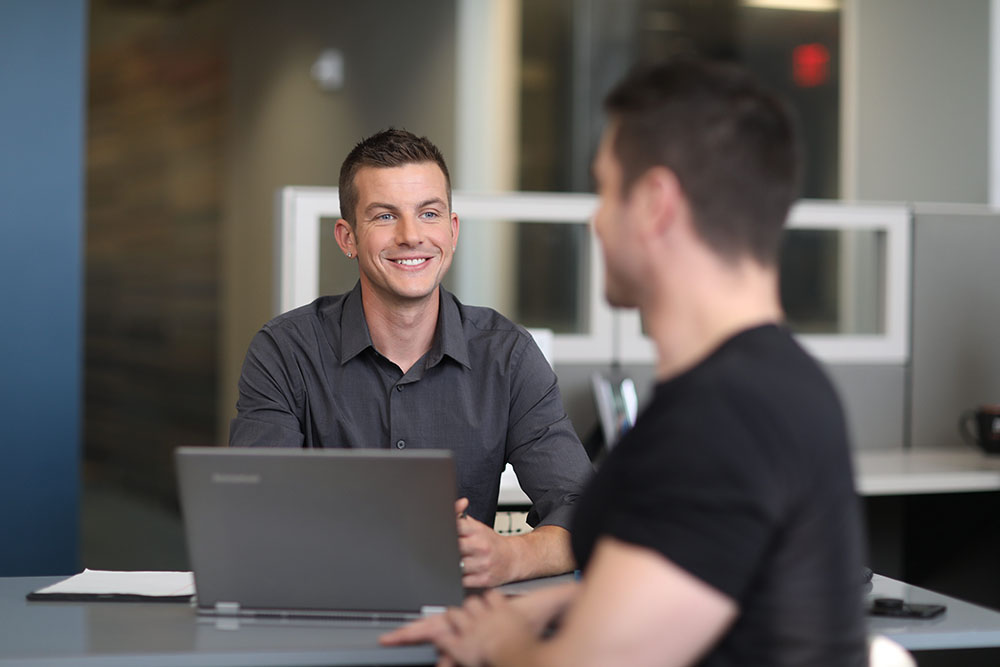 two employees talking to each other