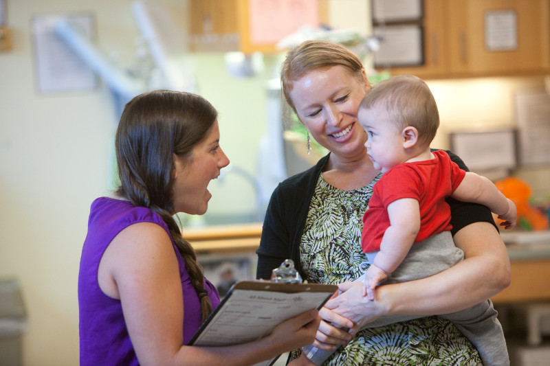 Two employees with baby