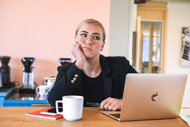 Young female professional contemplating a career pivot