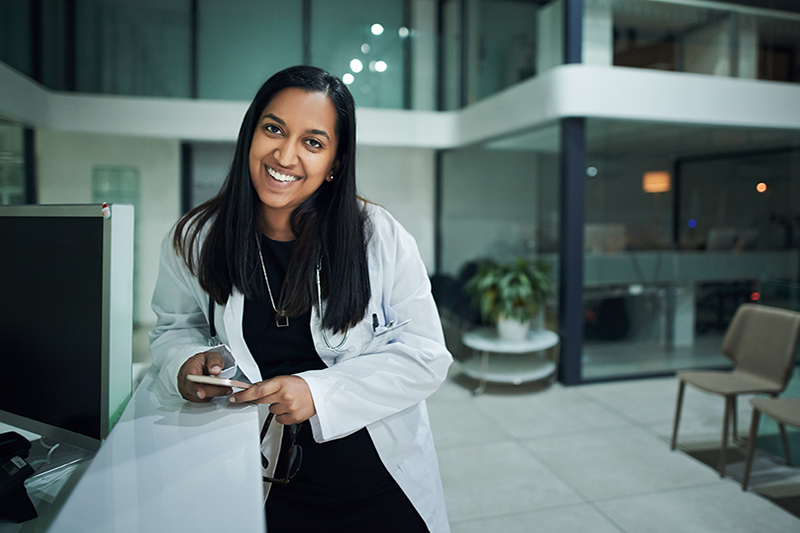 Female doctor smiling in a hospital setting