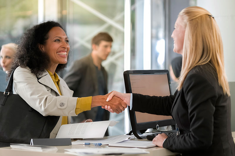 Frontline bank employee helping a customer