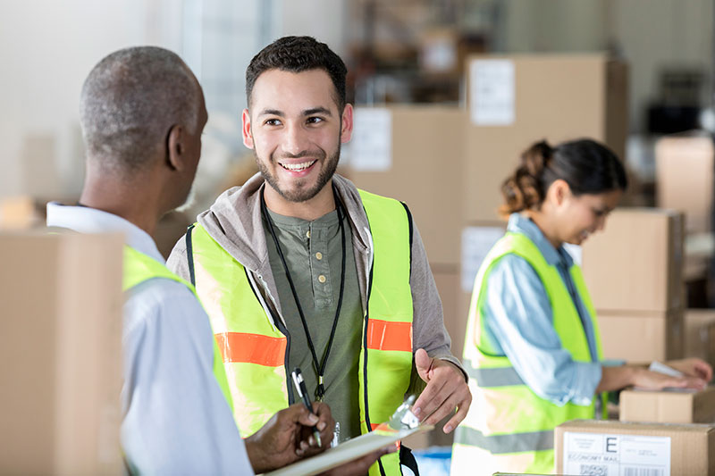 Warehouse employee using new skills from education assistance