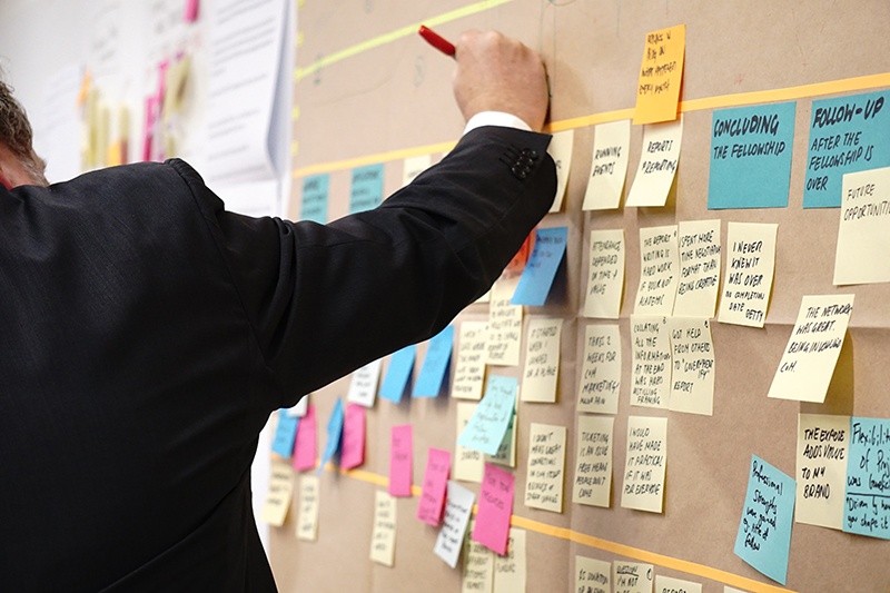 Adult learner studying for a certificate program using sticky notes