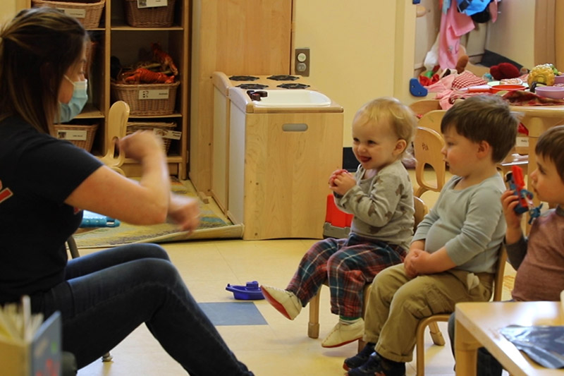 Hub center teacher doing an activity with her preschoolers