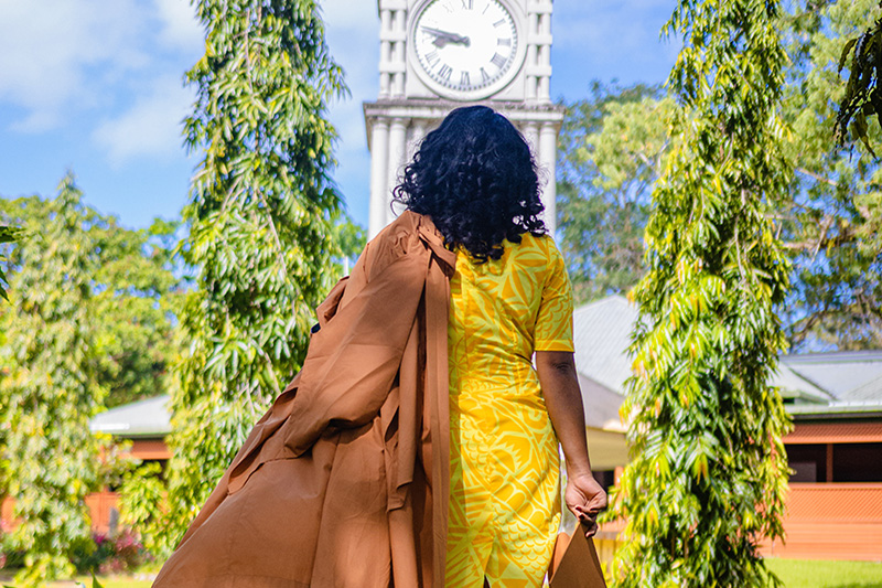 Female working learner going back to school on campus