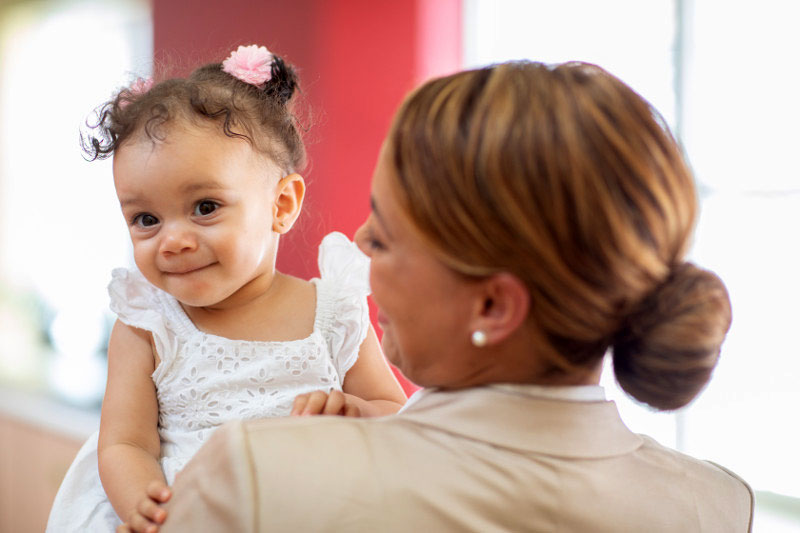 Working mom holding her baby girl before an interview