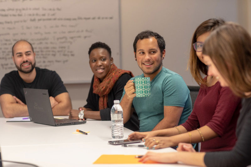 Group of happy employees in a meeting together