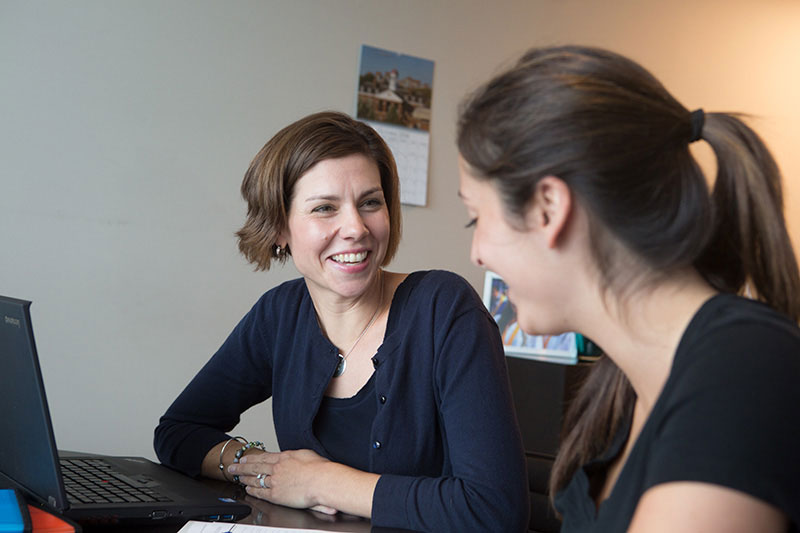 Female professor helping a college student