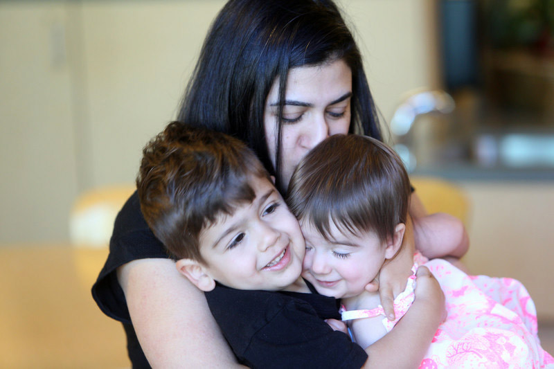 Mom balancing work and caring for her children