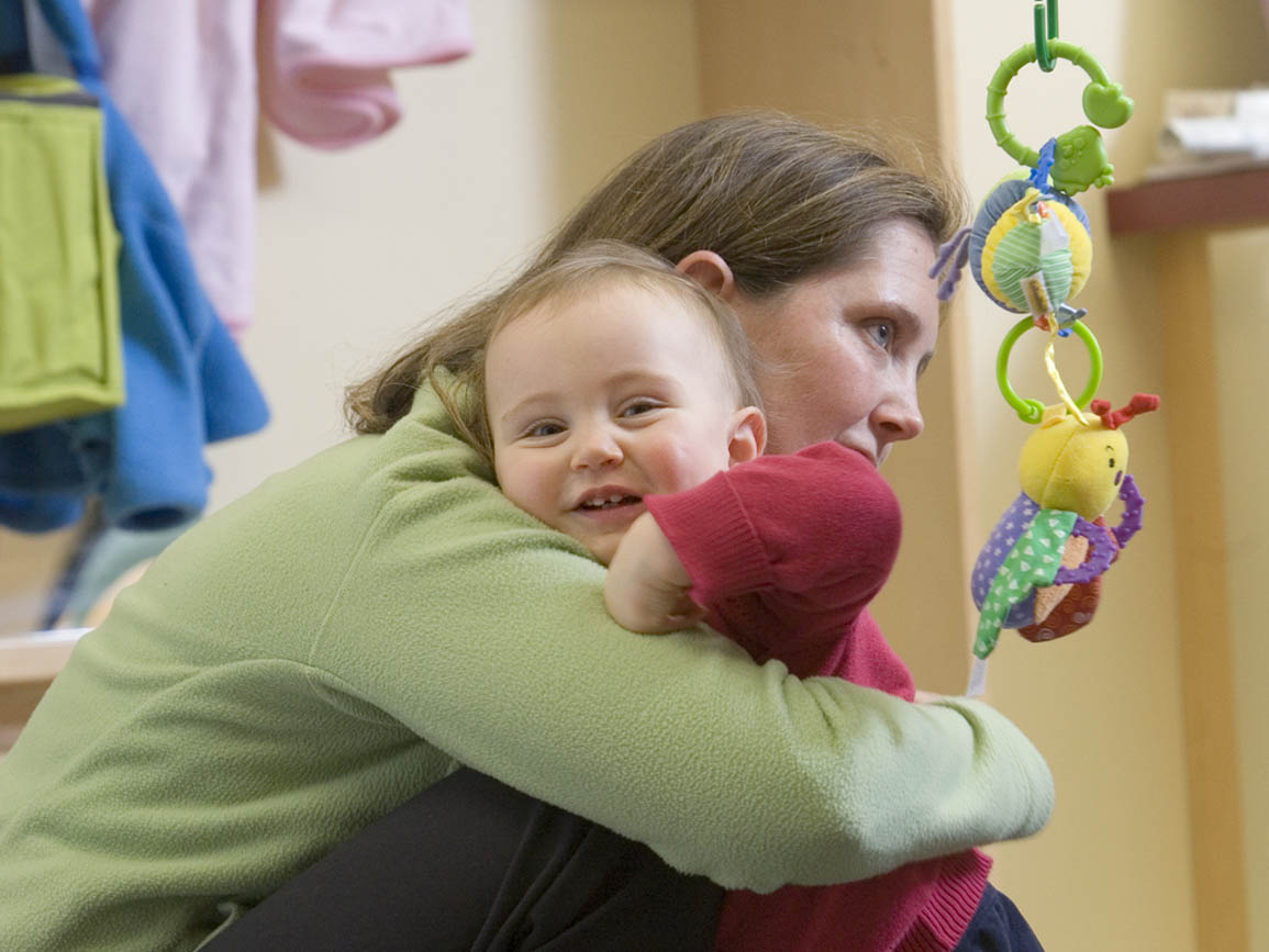 Baby hugging mom goodbye