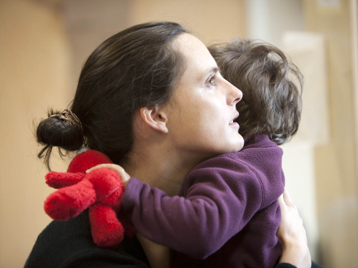 Mom hugging toddler