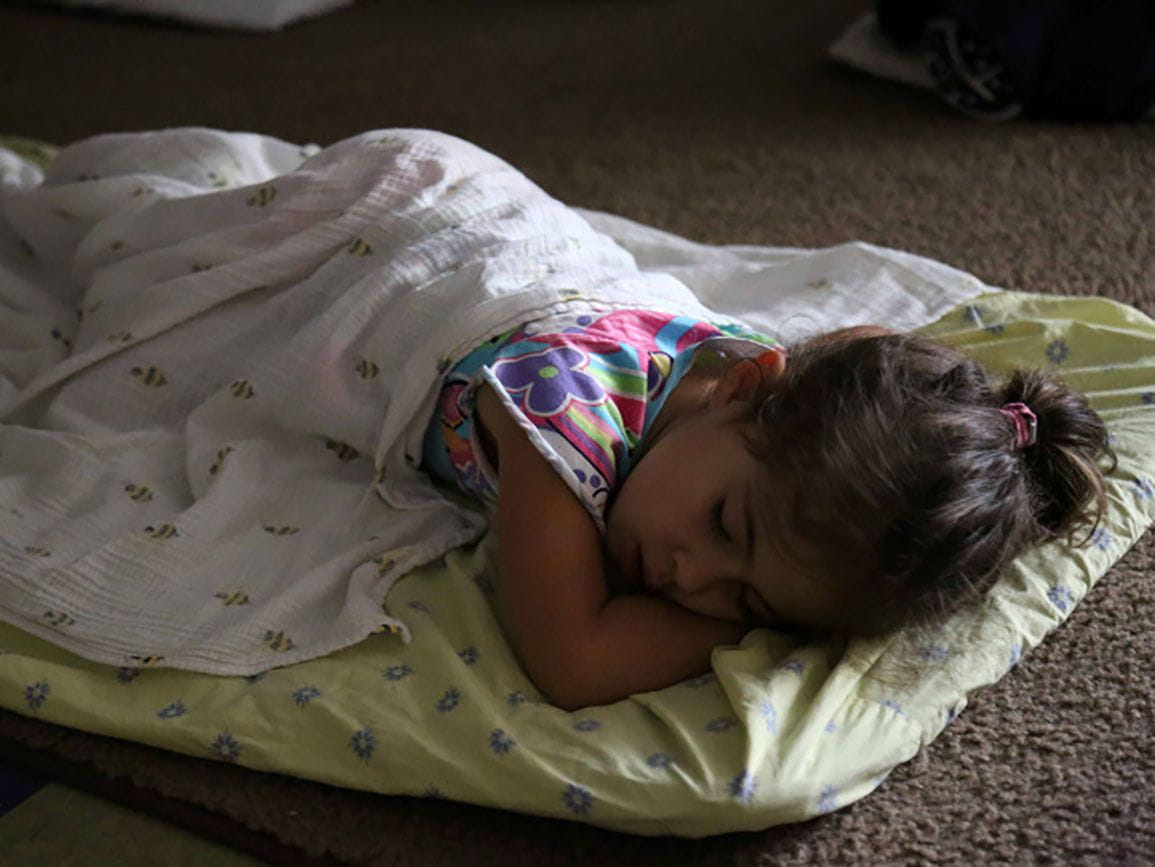 Young preschool girl taking a nap