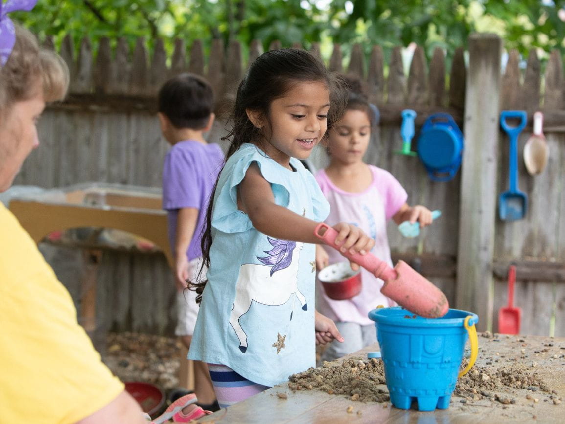 Children playing with sand outside