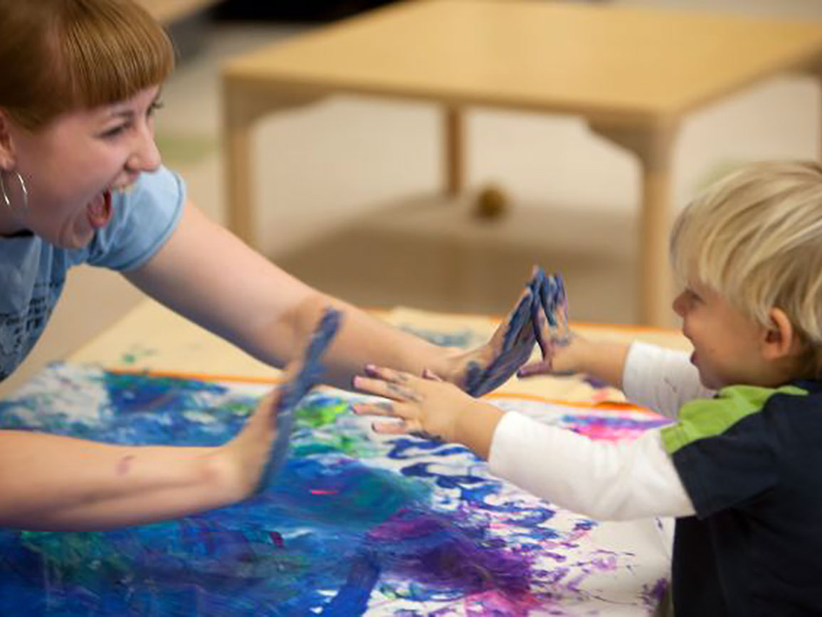 Mom and kid fingerpainting