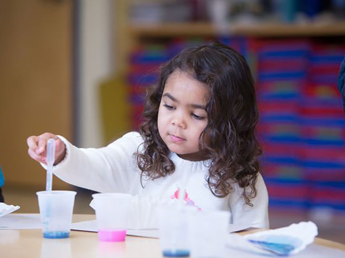 Preschool girl painting