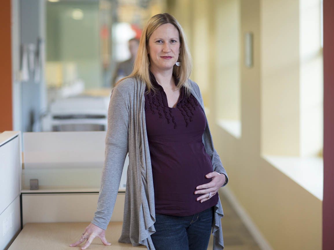 A pregnant woman at the office