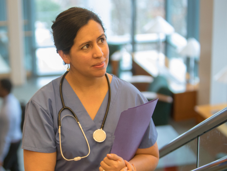 A female nurse walking up stairs