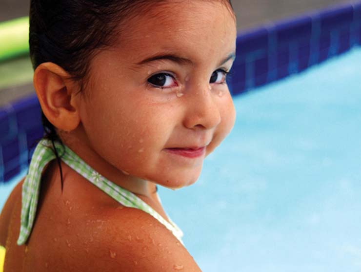 girl swimming as part of a family bucket list