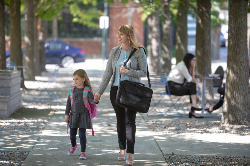 Working mom walking with child